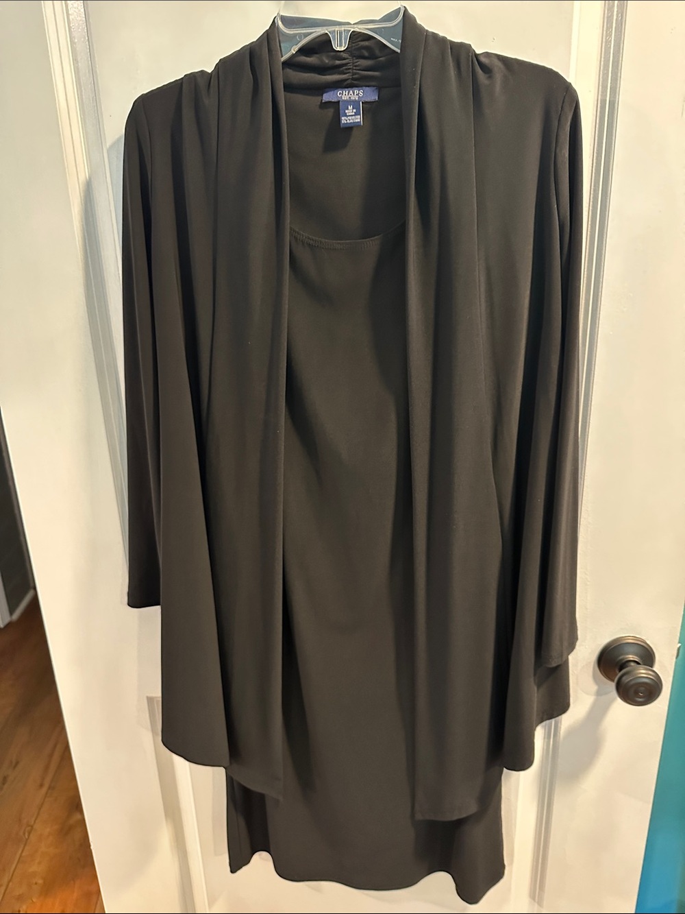 Chaps Women's Black Open-Front Draped Jacket over sleeveless dress.